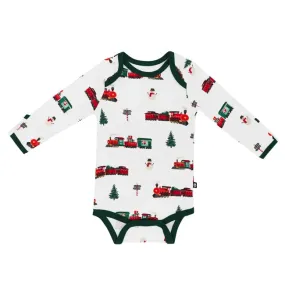 Kyte Baby Printed Long Sleeve Bodysuit in Holiday Train