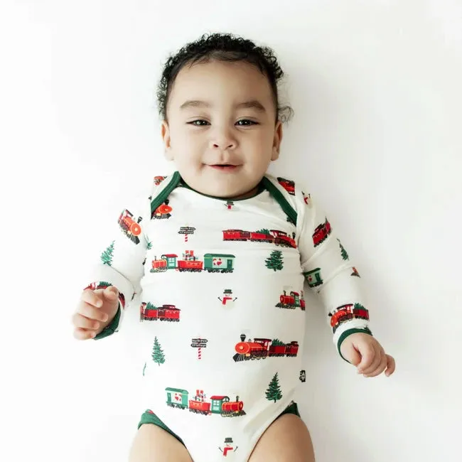 Kyte Baby Printed Long Sleeve Bodysuit in Holiday Train