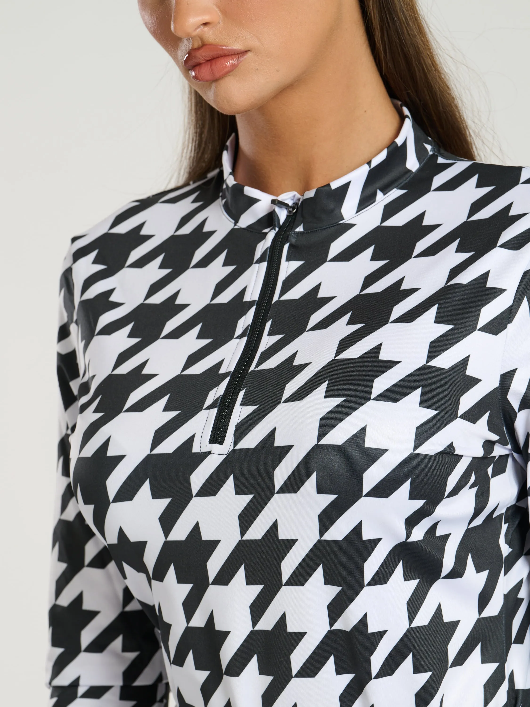 The 'Alps' half zip base layer in monochrome houndstooth